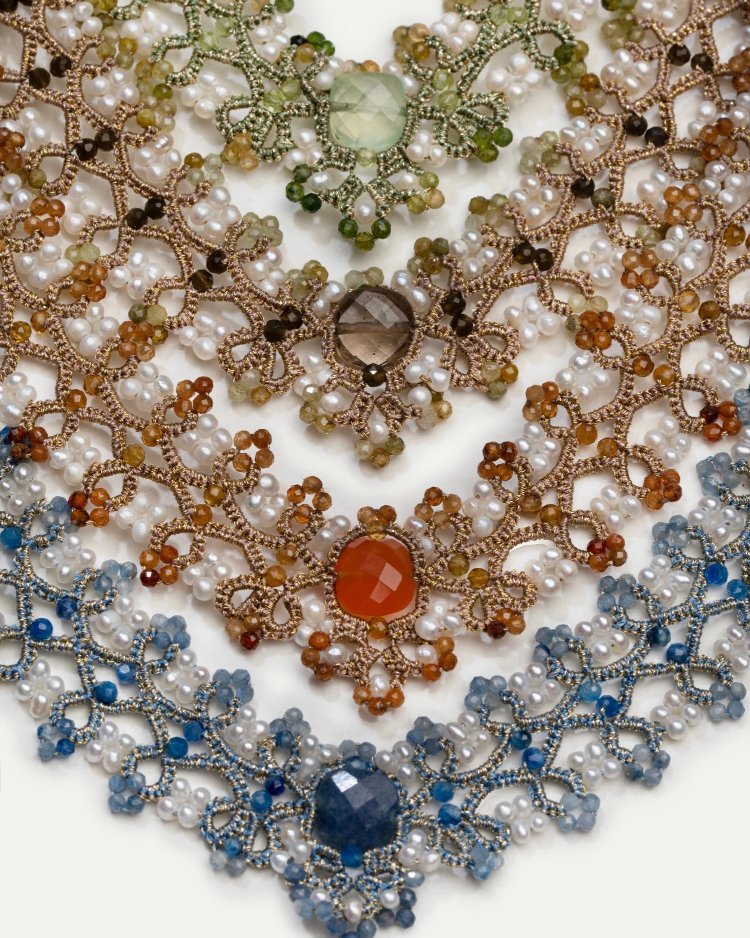 Blue silk and freshwater pearl necklace with kyanite detail, intricate texture and elegant design.