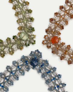 Blue silk and freshwater pearl necklace detail with kyanite accent.