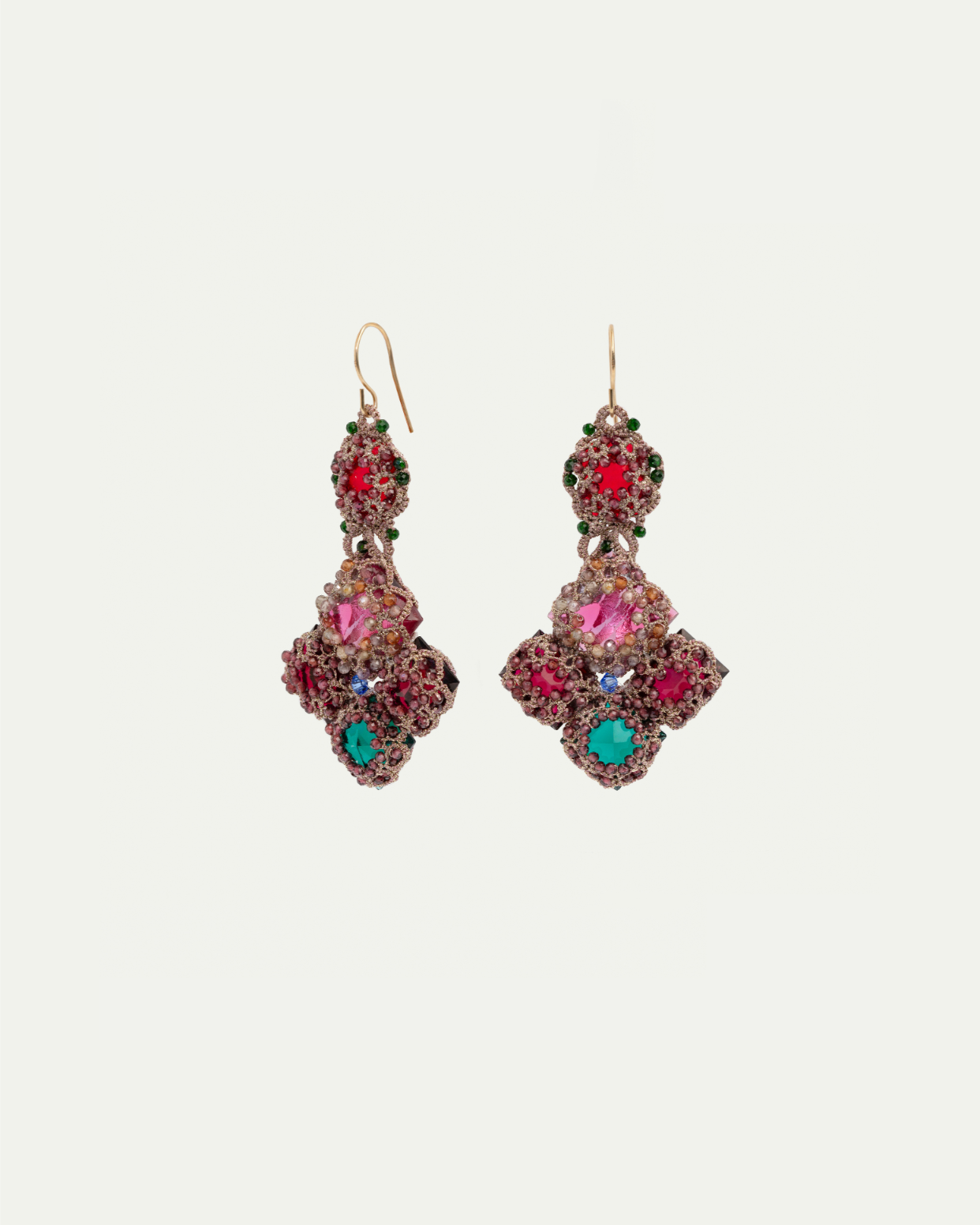 Intricate silk earrings with red, green, and turquoise gemstones, showcasing detailed craftsmanship.