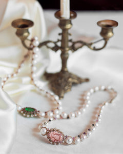 Rose SELENE NECKLACE detail with freshwater pearls, silk, pink crystal, textured accents on white background.