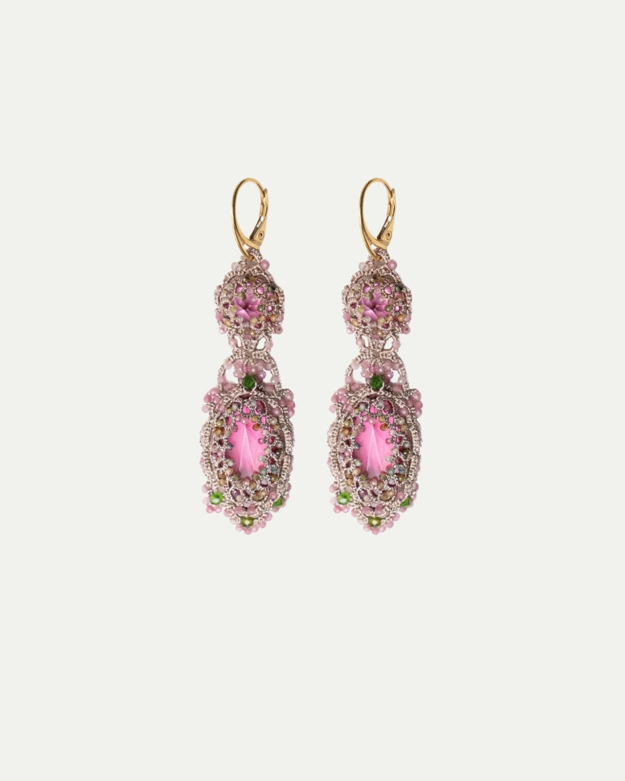 Elegant rose Serena earrings with intricate beadwork, featuring pink and green gems, gold hooks, and ornate design.
