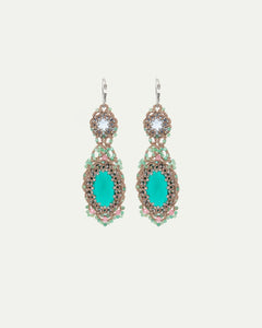 Green Serena Lux earrings with intricate crystal and bead detailing, silver hooks, and oval centerpiece.