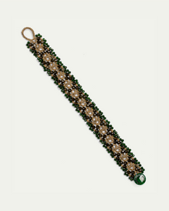 Green Tanya bracelet with intricate gold detailing and beaded design, side view angle.