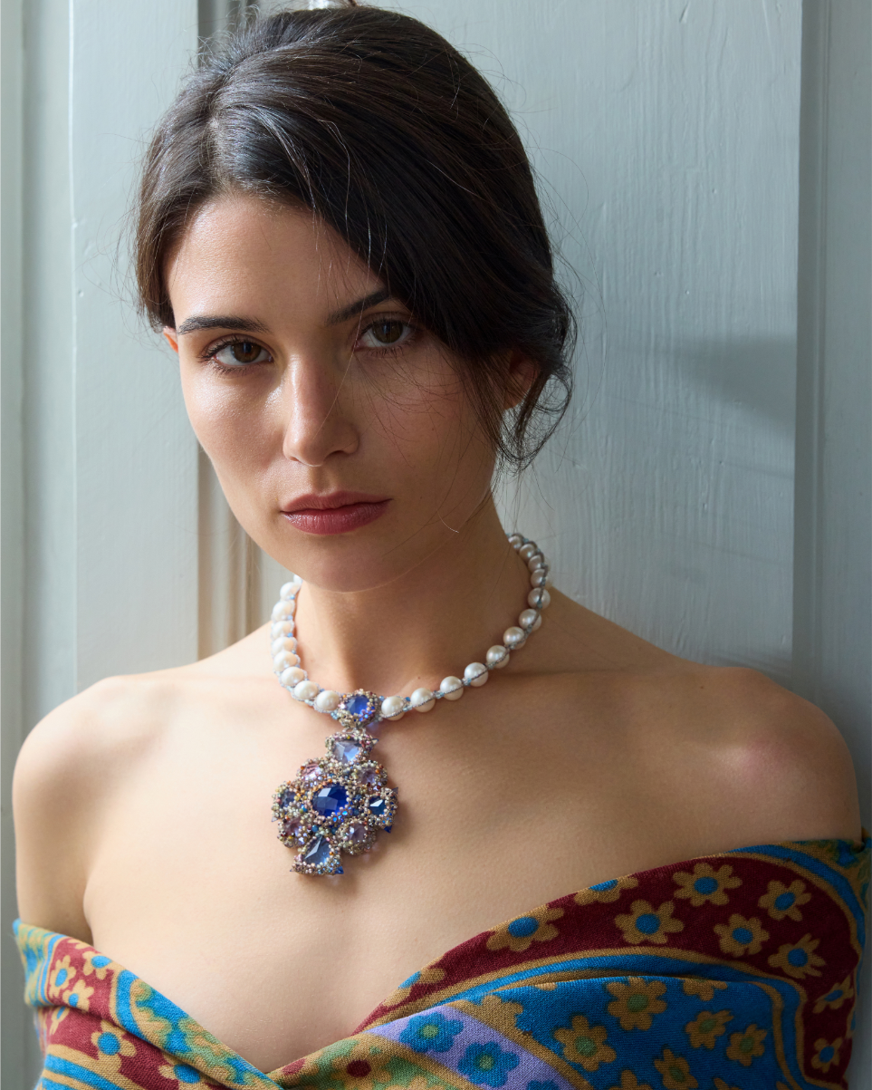 TIFFANY NECKLACE with pearls and multicolored gemstones on purple silk dress, elegant style.