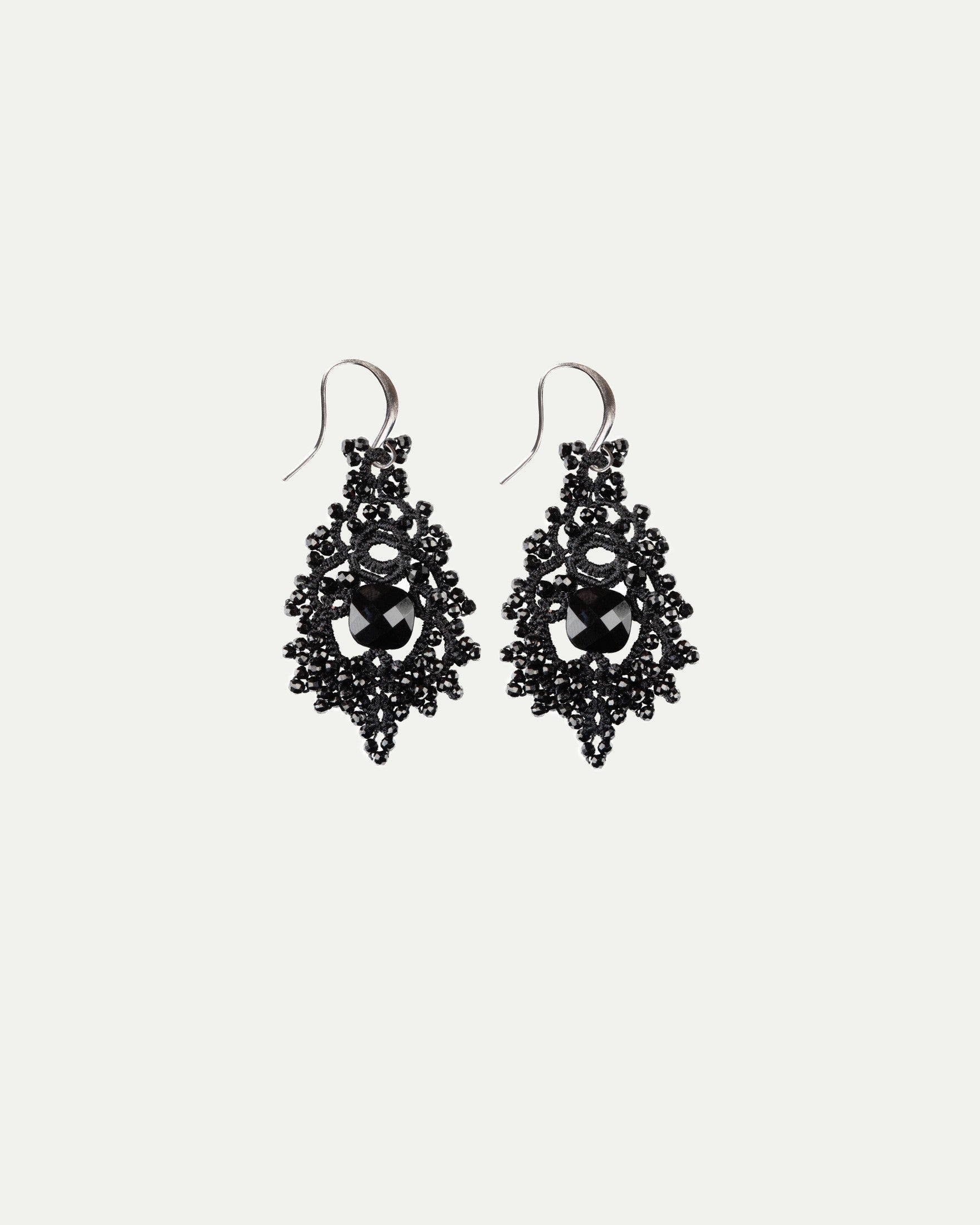 TIRAS earrings with black vintage glass, spinel gemstones, silk, and silver hooks.