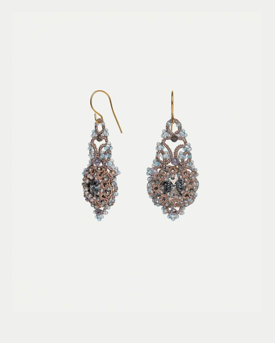 Blue Valentina earrings with gold hooks, intricate silk weaving, embellished with crystals, silver, and topaz.