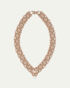 Vintaj necklace with moonstone, green garnet, gold silk threads, and mother of pearl button.